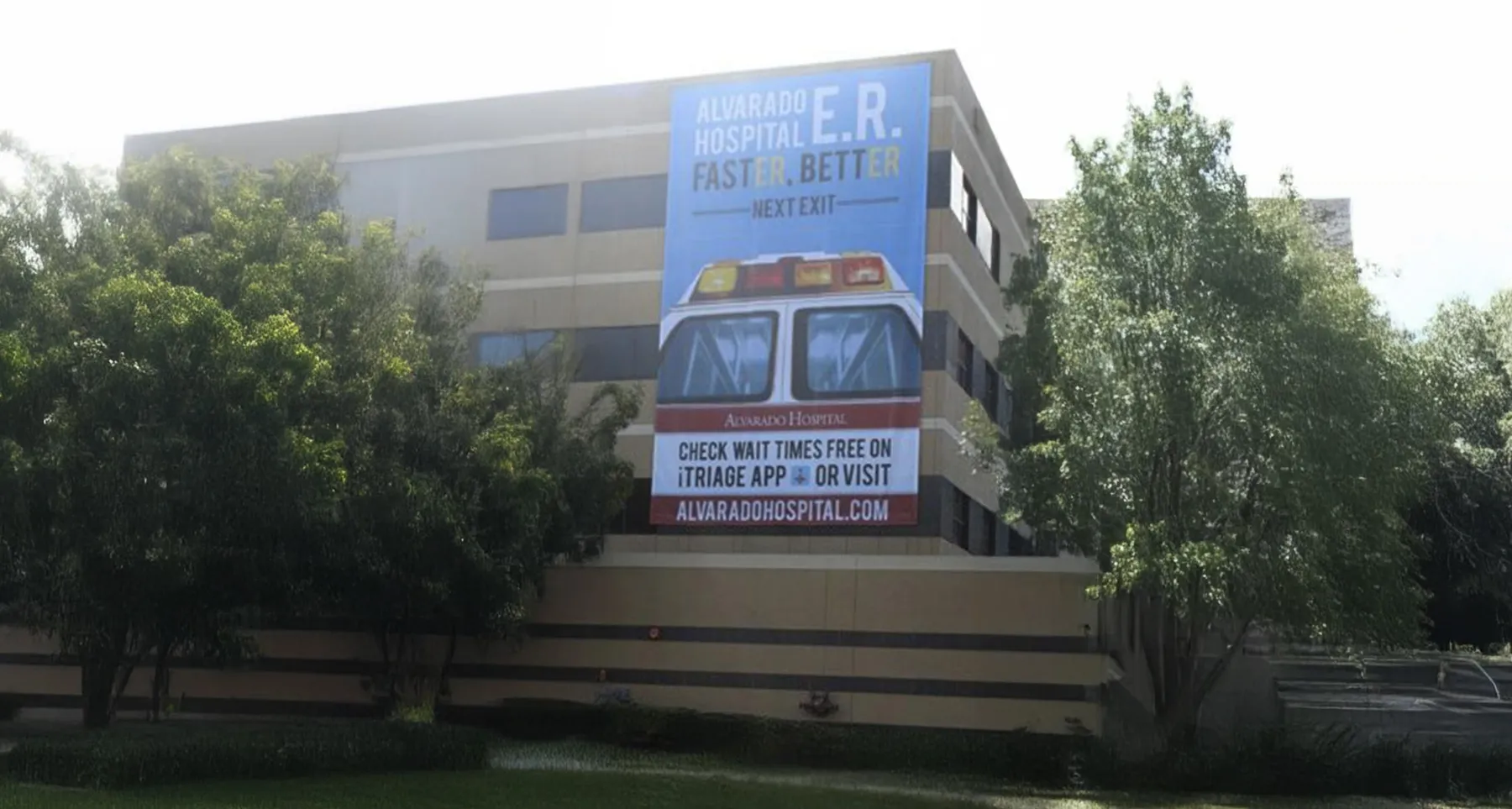 The Alvarado Hospital ER banner on the side of the hospital building, Keeks-era work for the former Alvarado Hospital brand