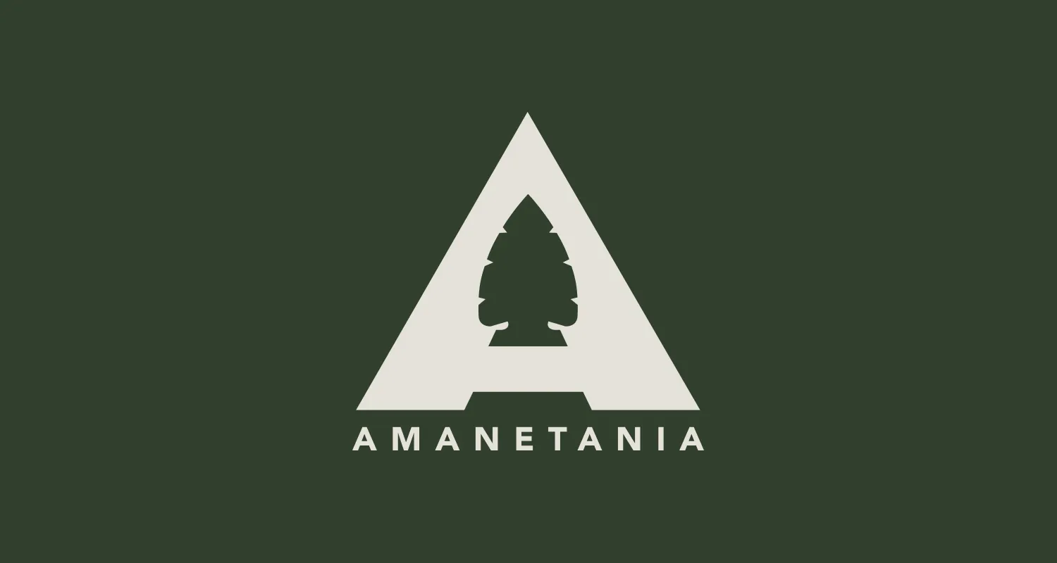 The Amanetania identity: a triangular A drawn as an arrowhead with a pine tree cut out of its center, the name set beneath it, in cream on forest green