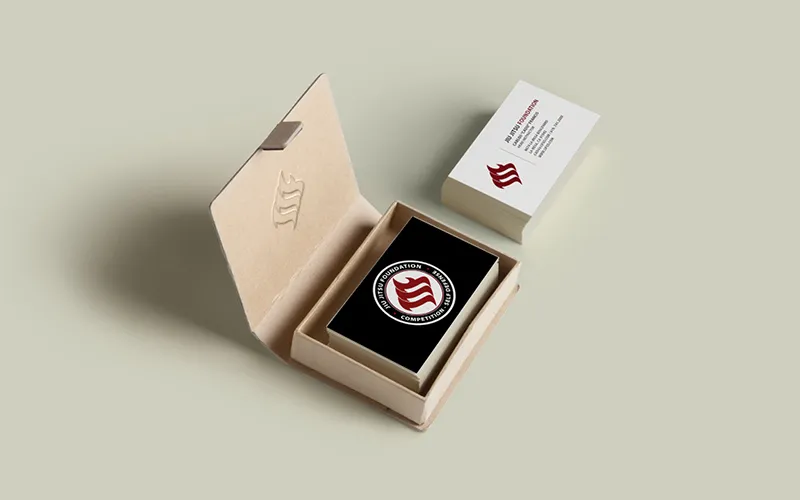 Academy business cards in a presentation box beside an enamel mark medallion