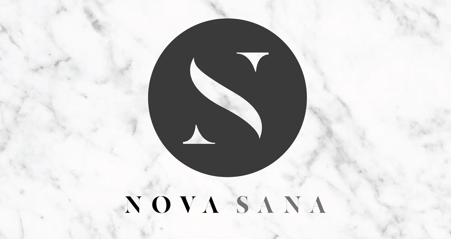 The Nova Sana mark: a curved S set in a dark circle above the name in wide-spaced capitals, on white marble