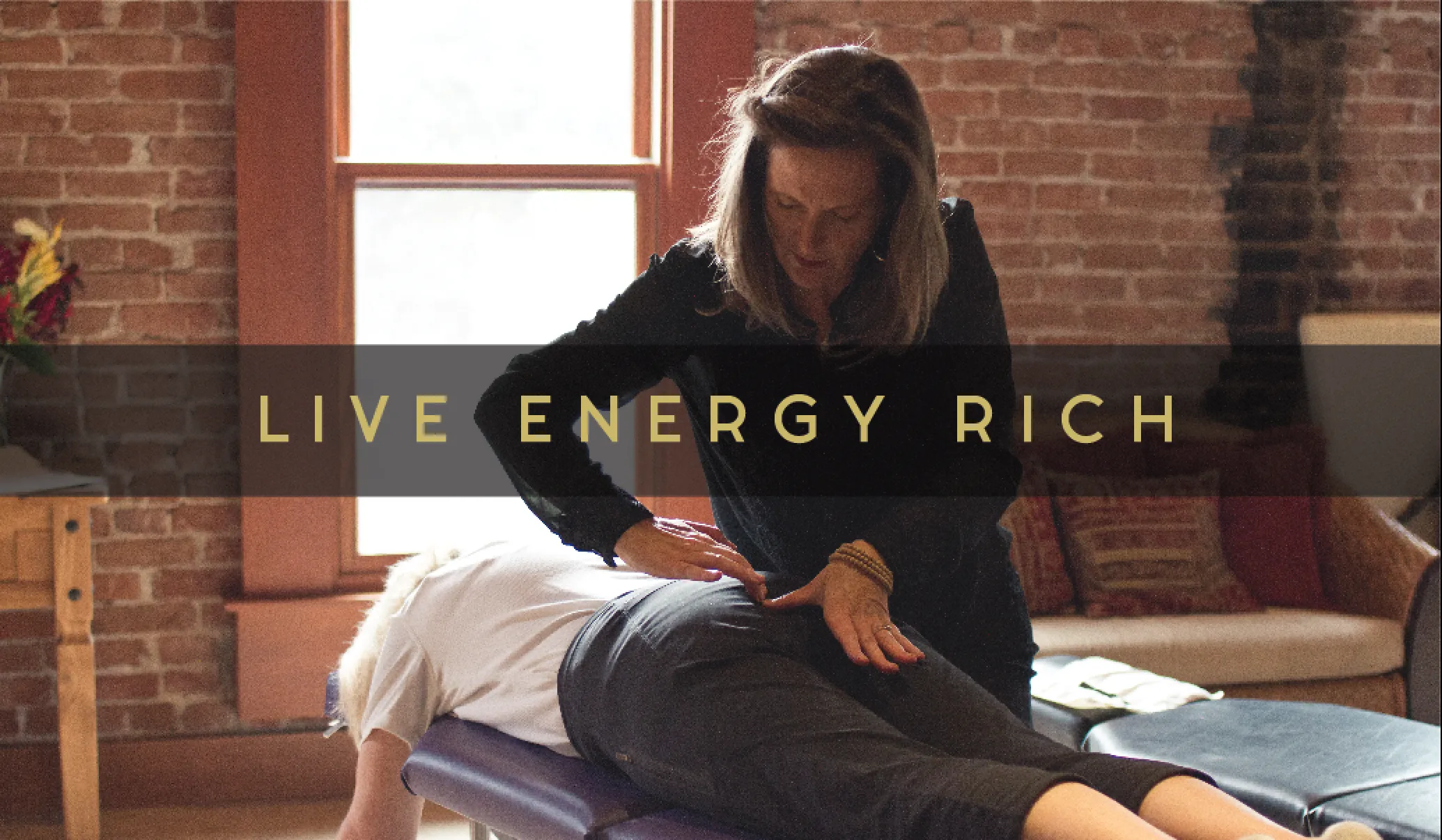 The business card back: the words live energy rich over a photograph of care in progress