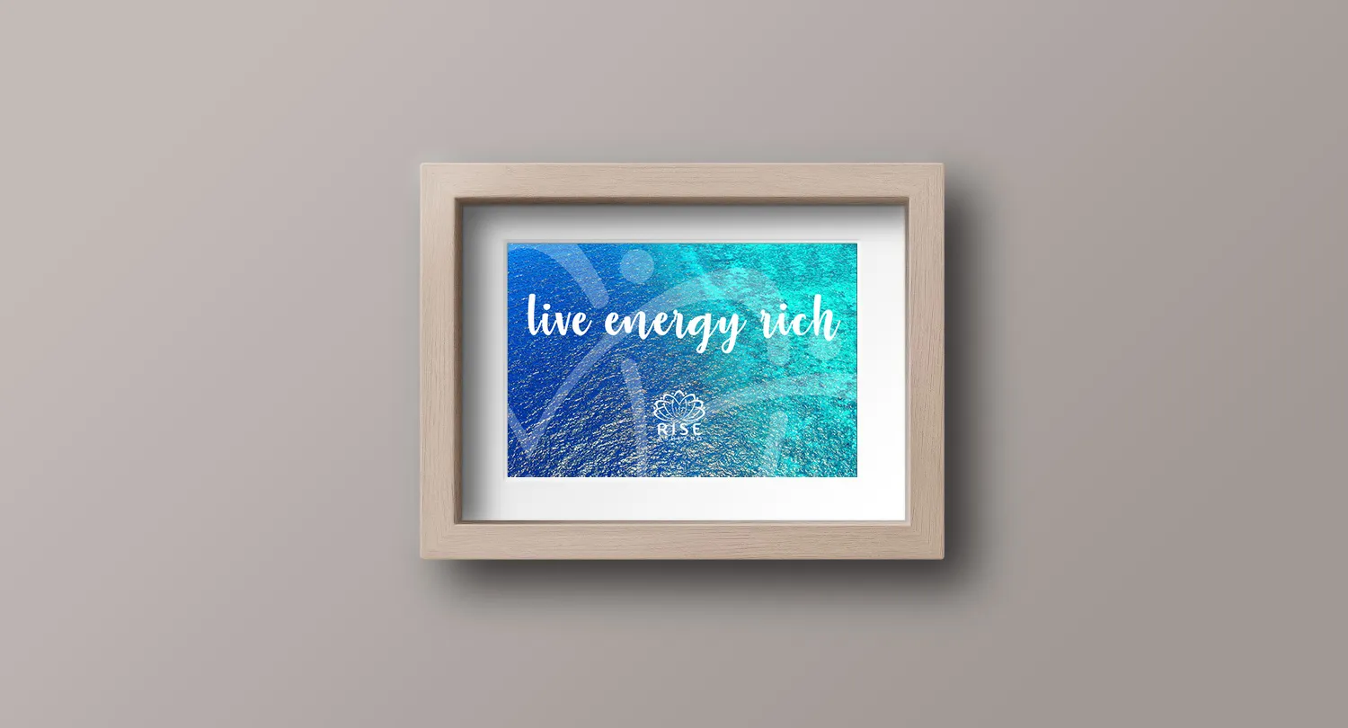 A framed print reading live energy rich, hung on a practice wall
