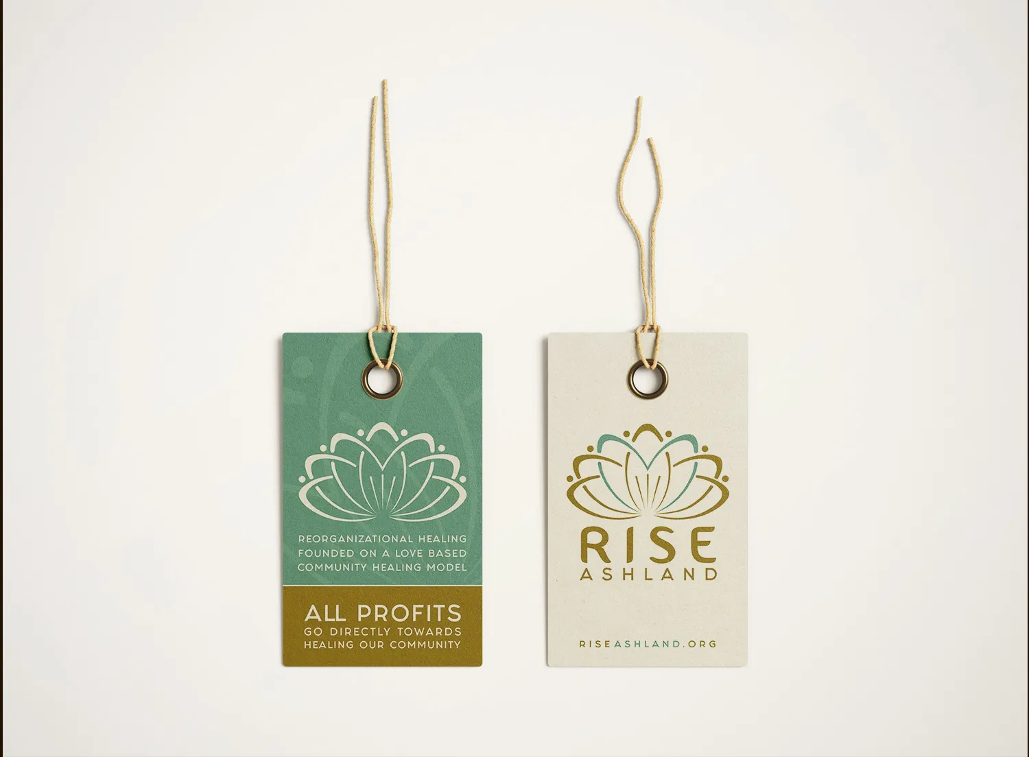 Two clothing hang tags, one carrying the mark and one the line about profits going back to the community