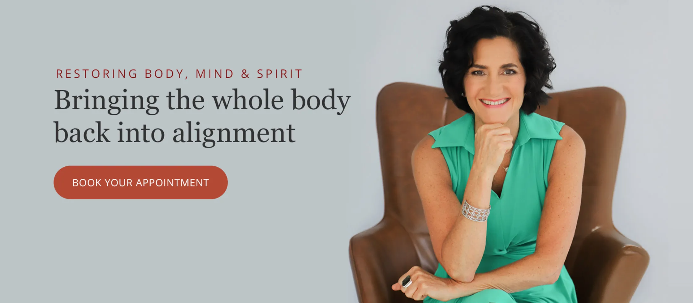 The Dr. Sherri Greene website homepage hero: a portrait of Dr. Greene beside the headline Restoring Body, Mind and Spirit, Bringing the whole body back into alignment, with a Book Your Appointment button